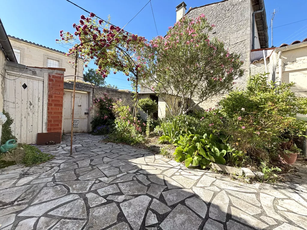 Maison de plain-pied au coeur de ville